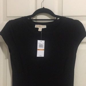 Floor length black Michael Kors dress.